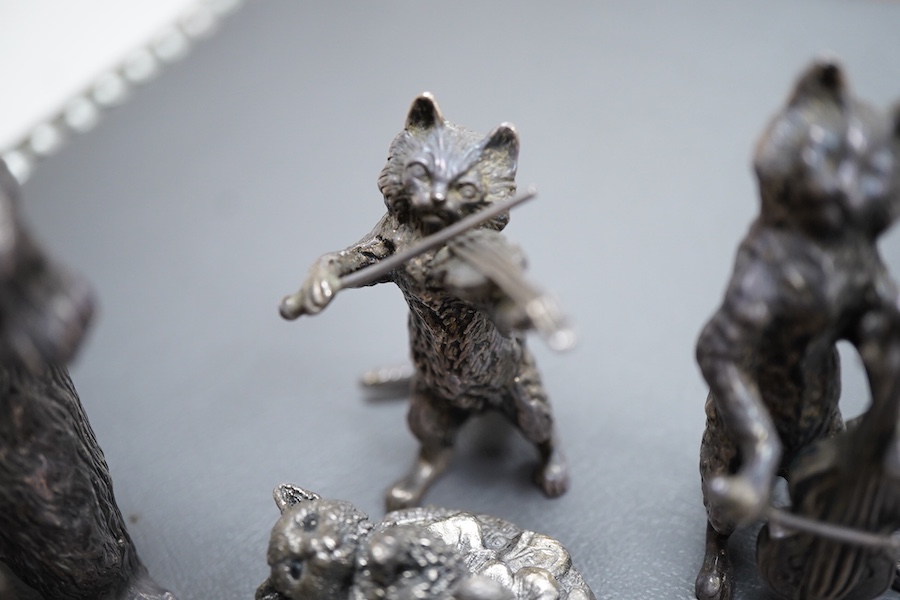 An Elizabeth II silver four piece miniature cat band by S.J. Rose & Son, Birmingham, 1976, tallest 58mm, together with a modern 925 miniature model of a standing grizzly bear and a modern silver model of a kitten(filled)